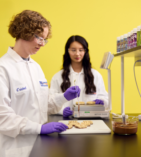 women in a lab wearing lab coats