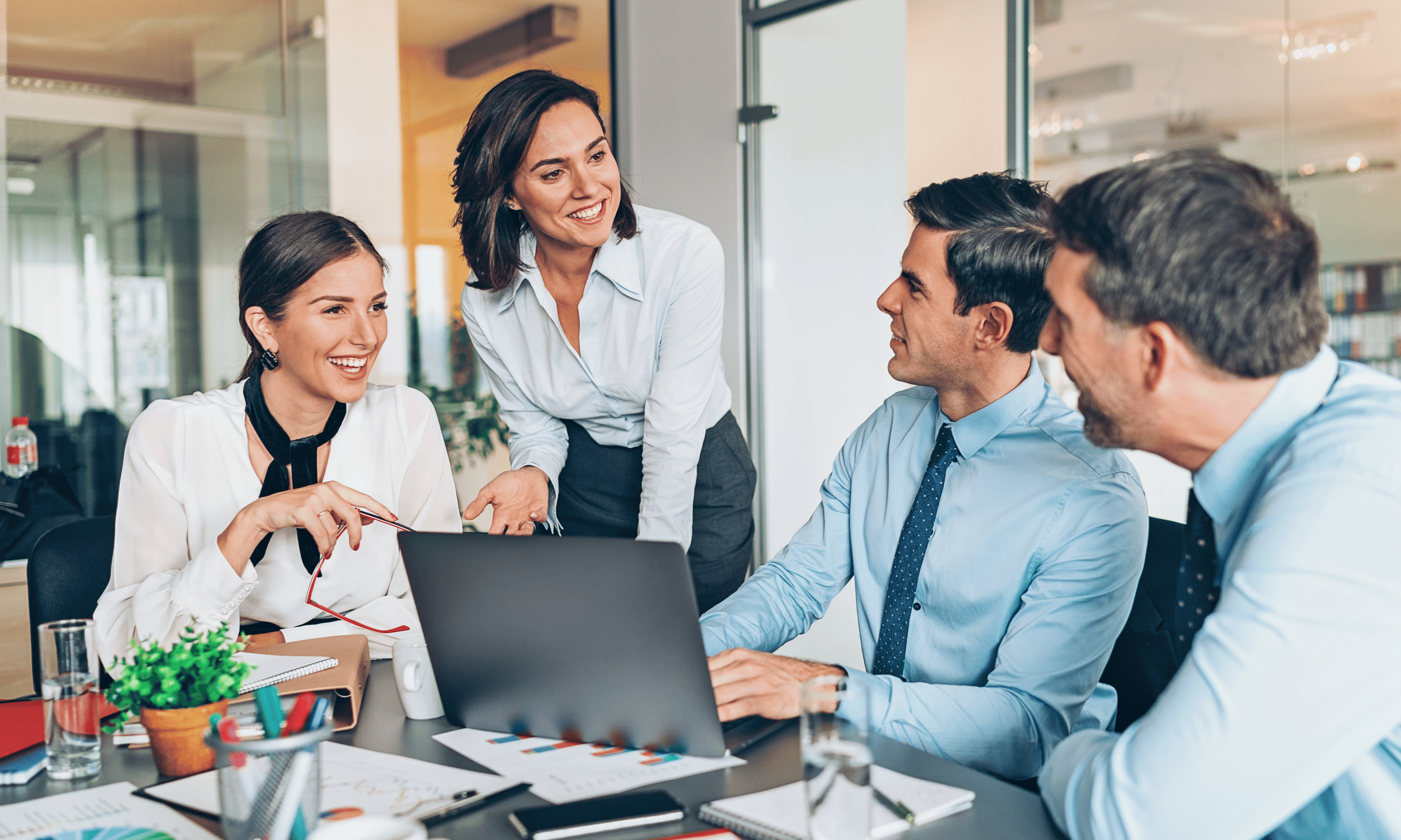 four people in an office