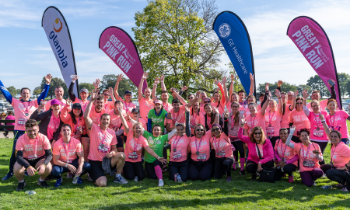 group of people wearing great pink run t-shirts and taking part in the run