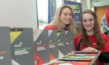 two of the glanbia grad team with the graduate programme brochure 