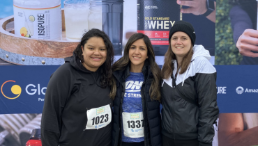three volunteers at a charity race