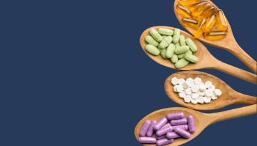 four wooden spoons with different supplements on each one