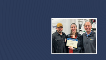 three people, man, woman, man, standing with certificate