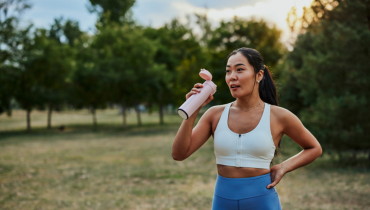 girl drinking from container