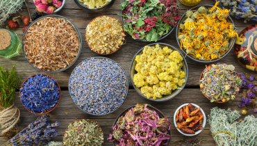 table full of bowls of different ingredients and spices