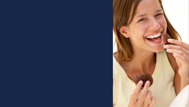 girl eating chocolate muffin