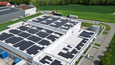 aerial view of manufacturing plant in Germany with solar panels