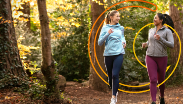two girls running through the forrest