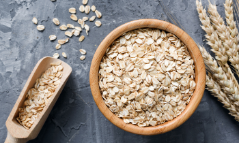 a bowl of oats and a scoop