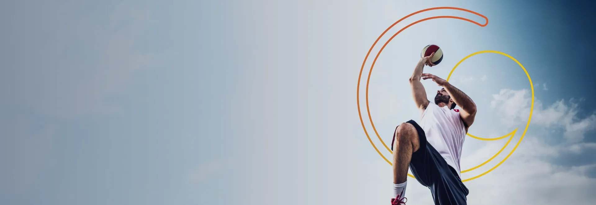person playing basketball with the sky and Glanbia logo in the background