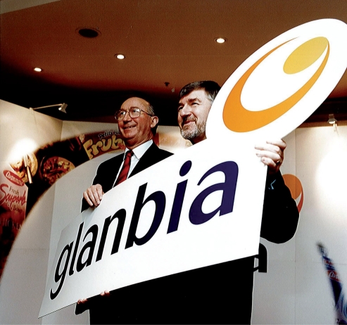 two men holding a glanbia sign