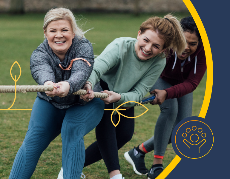 three women playing tug of war