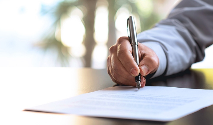 a man signing a document