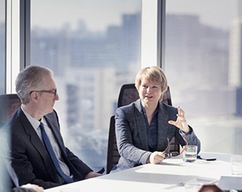 a man and a woman discussing work