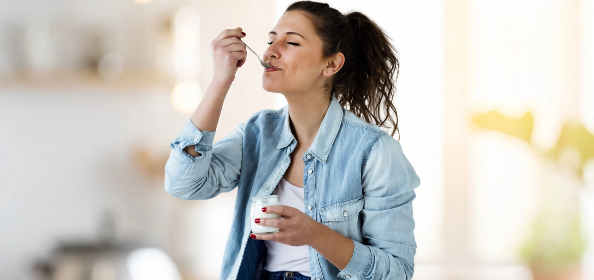 woman eating yogurt