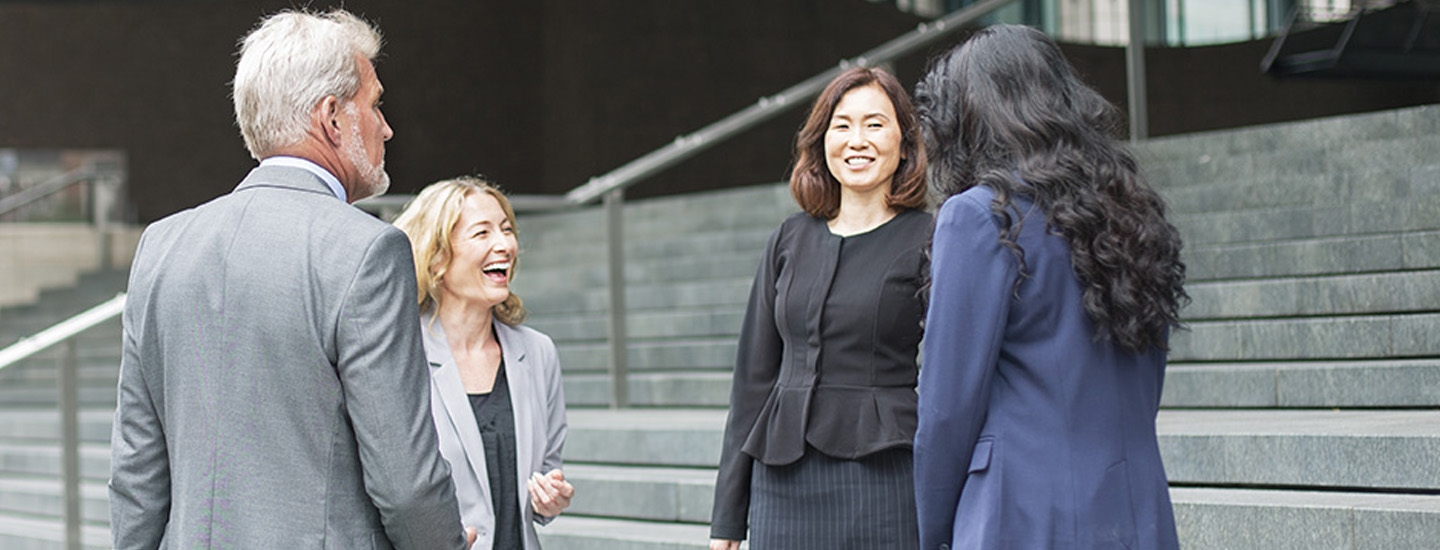 a group of people laughing and discussing