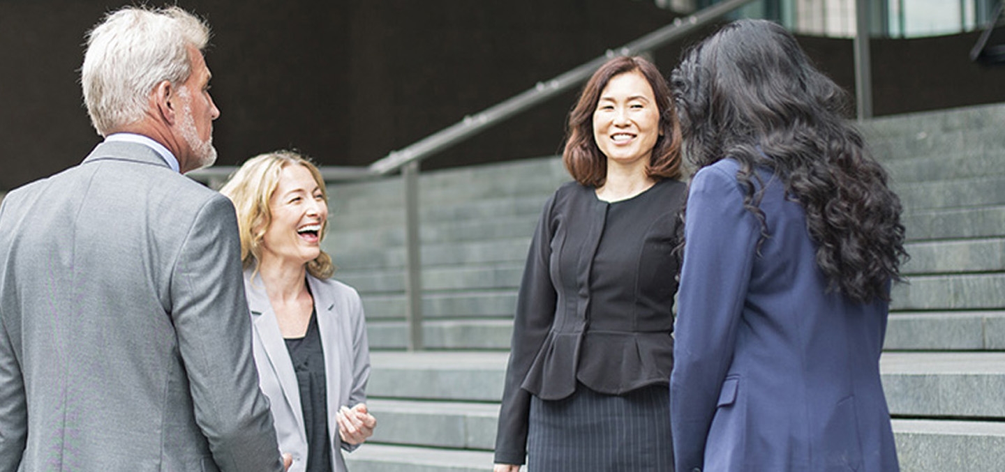 a group of people laughing and discussing