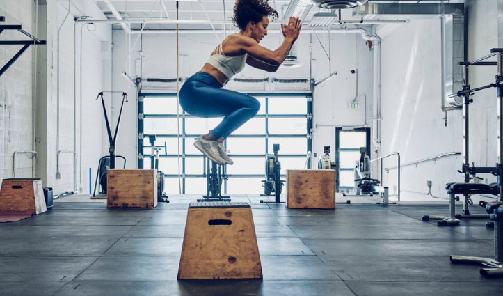 woman jump box gym