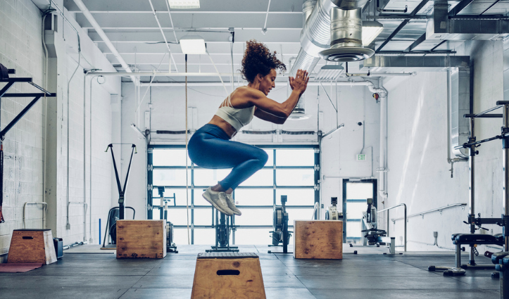 woman jump box gym