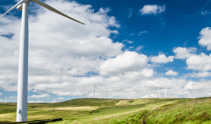 windmills, clouds, green hilll