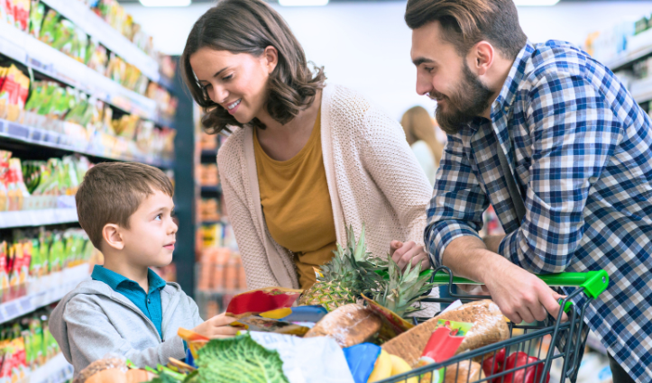 family in the aisle of a supermarket