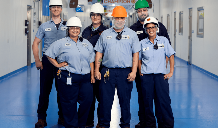 warehouse workers standing for a photo