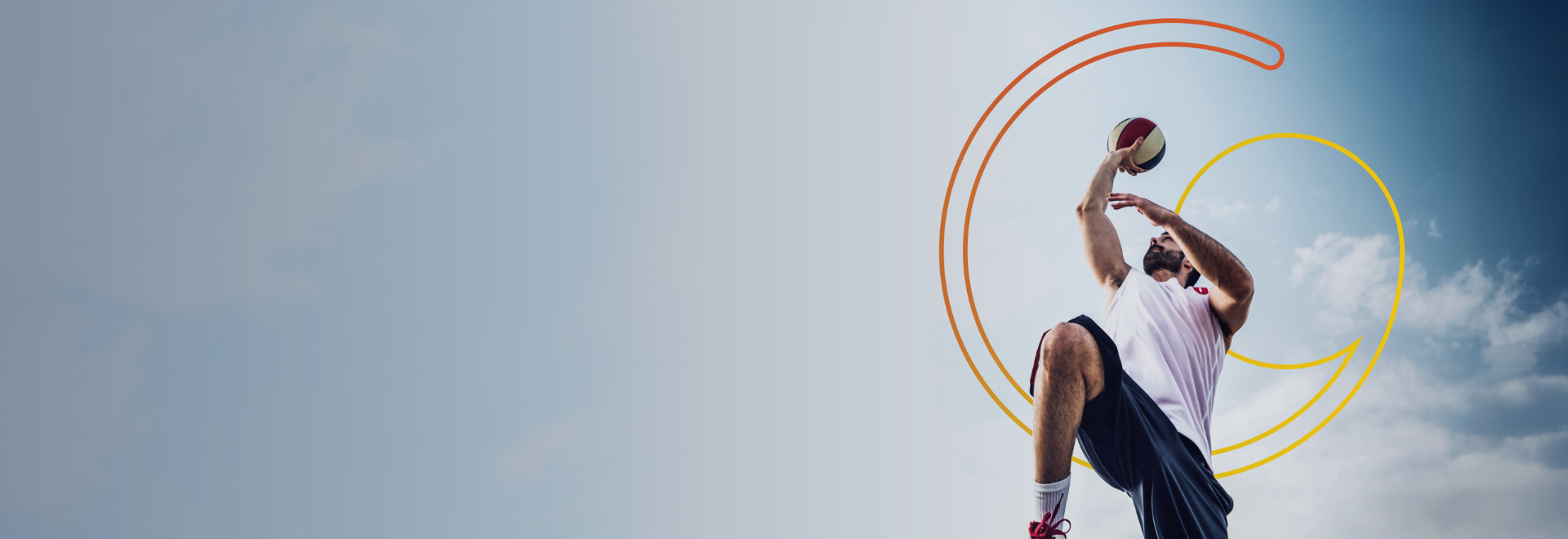 person playing basketball with the sky and Glanbia logo in the background