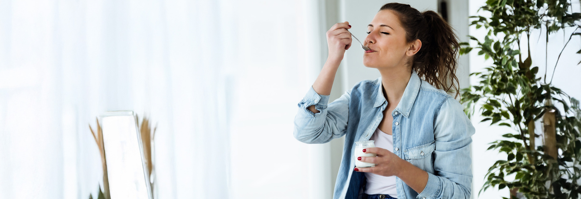 woman eating yoghurt