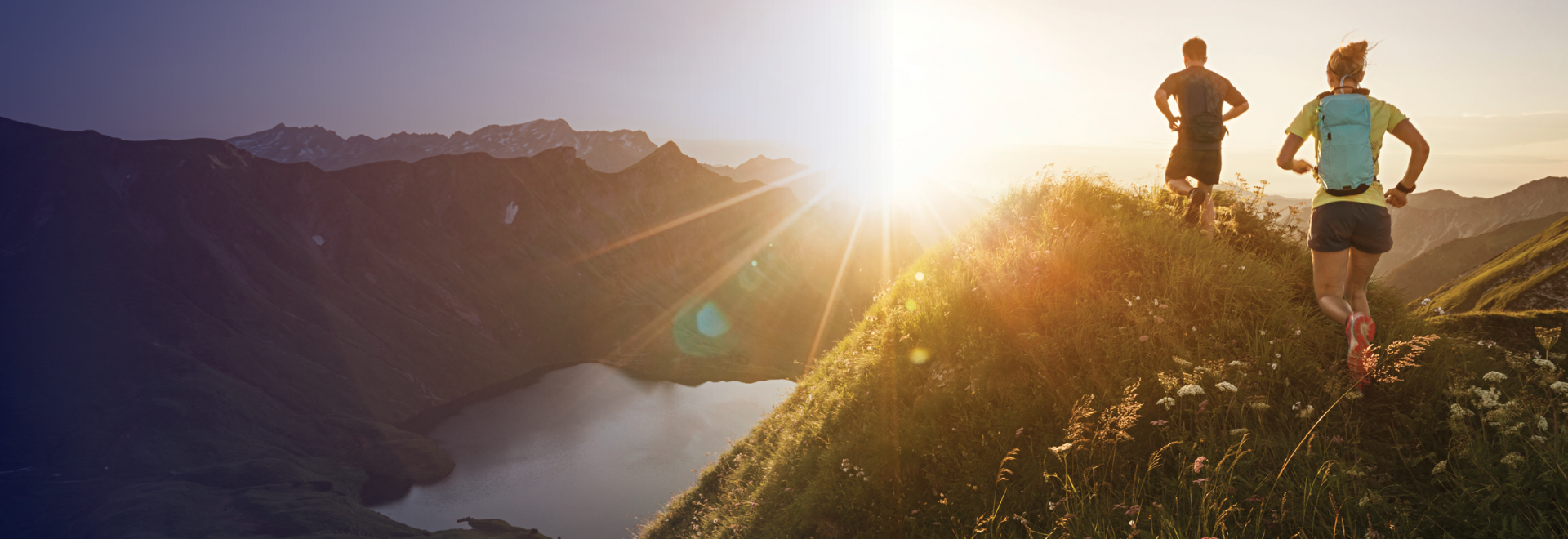 two people running on a mountain