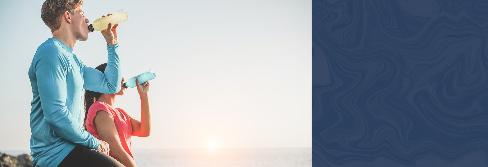 man drinking yellow energy drink, woman drinking blue energy drink