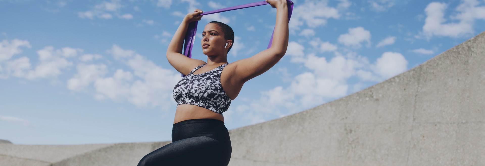 woman holding resistance band